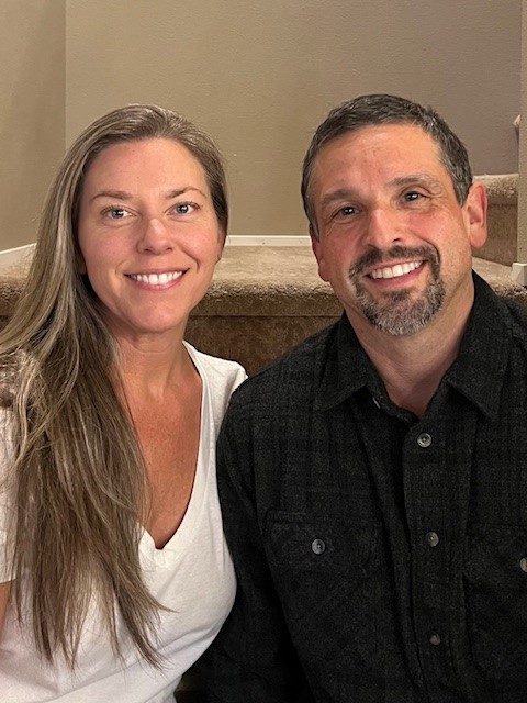 Electrician Corey Johnson and his wife at home.